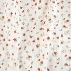 Tissu maille pointelle motif petites fleurs terracotta – fond blanc cassé