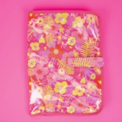 Tissu plastifié imprimé fleurs sur fond fuchsia