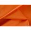 Tissu polyester orange déperlant pour parapluie .