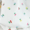 Tissu popeline de coton brodée cerises multicouleurs