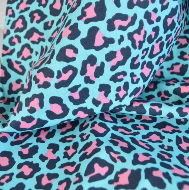 Tissu Popeline de coton motif léopard bleu turquoise