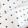Tissu popeline de coton motif coeurs noirs fond blanc