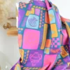 Tissu popeline de coton Poppy – motif patchwork d'été fond pétrole