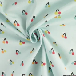 Tissu popeline Esteve motif cerises fond bleu