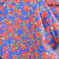 Tissu Popeline Happy Flowers motif fleurs fond bleu