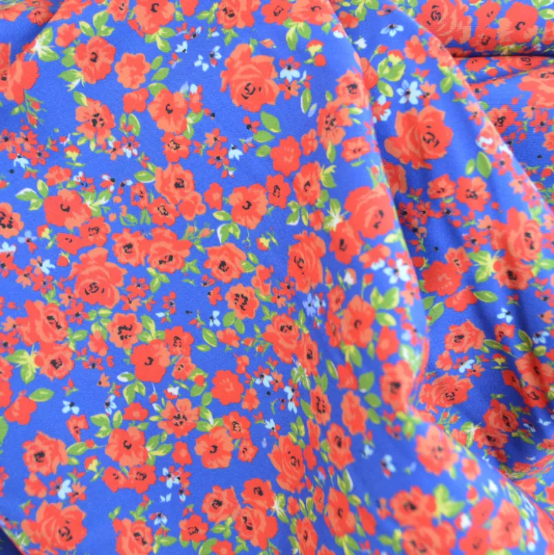 Tissu Popeline Happy Flowers motif fleurs fond bleu