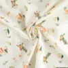 Tissu popeline motif girafes et fleurs roses fond bleu - Oeko tex