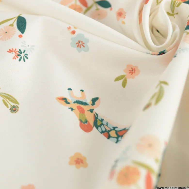 Tissu popeline motif girafes et fleurs roses fond bleu - Oeko tex