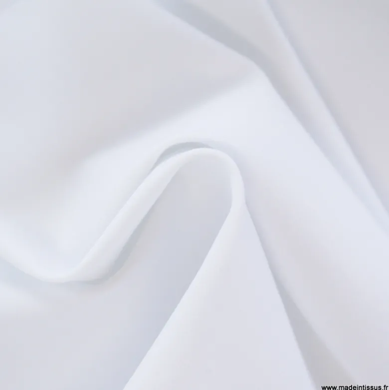 Tissu pour pantalon d'équitation maille stretch blanc.