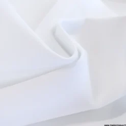 Tissu pour pantalon d'équitation maille stretch blanc.