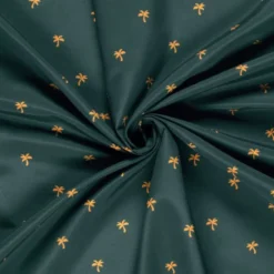 Tissu pour short de bain déperlant motif palmiers fond pétrole