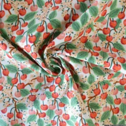 Tissu Rifle Paper motif fleurs de cerisiers et cerises fond écru - Collection Garden Party