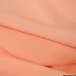 Tissu satin microfibre fluide uni Corail.