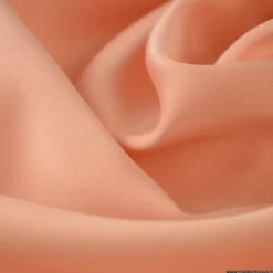 Tissu satin microfibre fluide uni Corail.