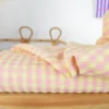 Tissu seersucker Vichy grands carreaux rose et jaune pâle