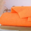 Tissu seersucker Vichy petits carreaux orange fluo