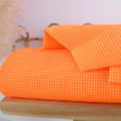 Tissu seersucker Vichy petits carreaux orange fluo