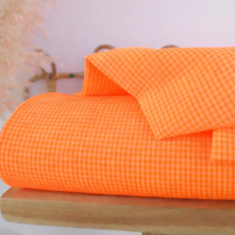 Tissu seersucker Vichy petits carreaux orange fluo