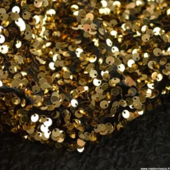 Tissu Sequin doré sur velours noir