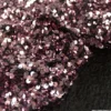 Tissu Sequin vieux rose sur velours noir
