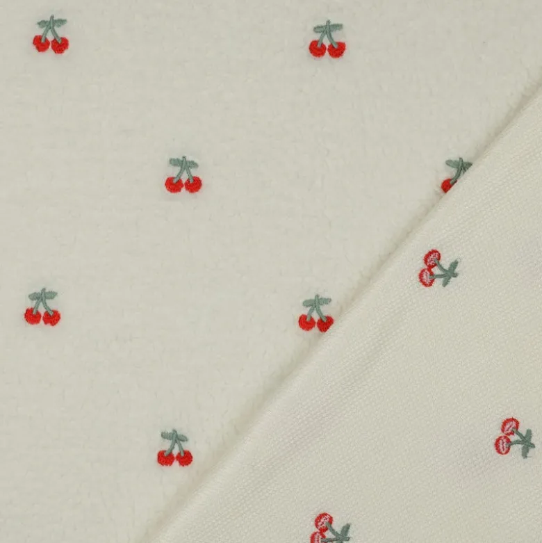 Tissu Sherpa brodée motif cerises fond écru