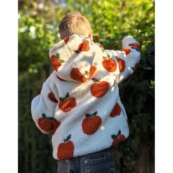 Tissu Sherpa motif pommes orangées fond écru
