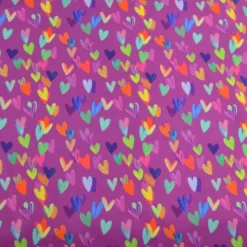 Tissu softshell motif cœurs multicolores fond violet rose