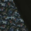 Tissu Softshell motifs dinosaures fond noir