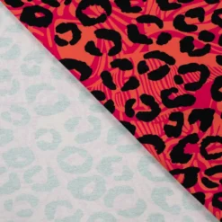Tissu Sweat French Terry léopard fond Saumon