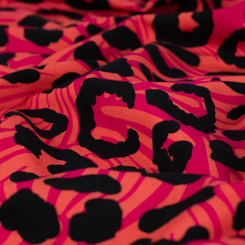 Tissu Sweat French Terry léopard fond Saumon