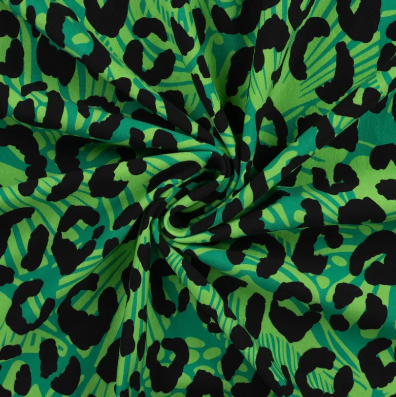 Tissu Sweat French Terry léopard fond Vert