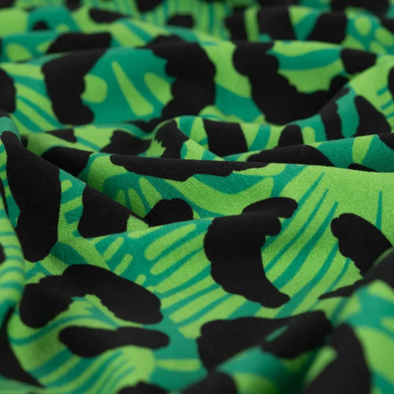 Tissu Sweat French Terry léopard fond Vert