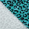 Tissu Sweat French Terry léopard fond bleu Tiffany