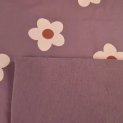 Tissu Sweat French terry motif fleurs fond parme - OEKO TEX