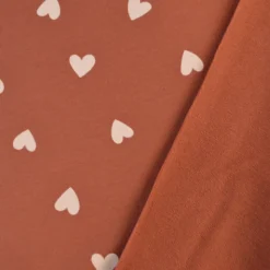 Tissu Sweat French terry motif coeurs fond vieux rose - OEKO TEX