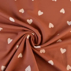 Tissu Sweat French terry motif coeurs fond vieux rose - OEKO TEX