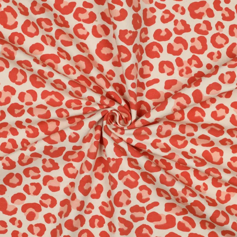Tissu Sweat gratté motif Léopard orange fond écru