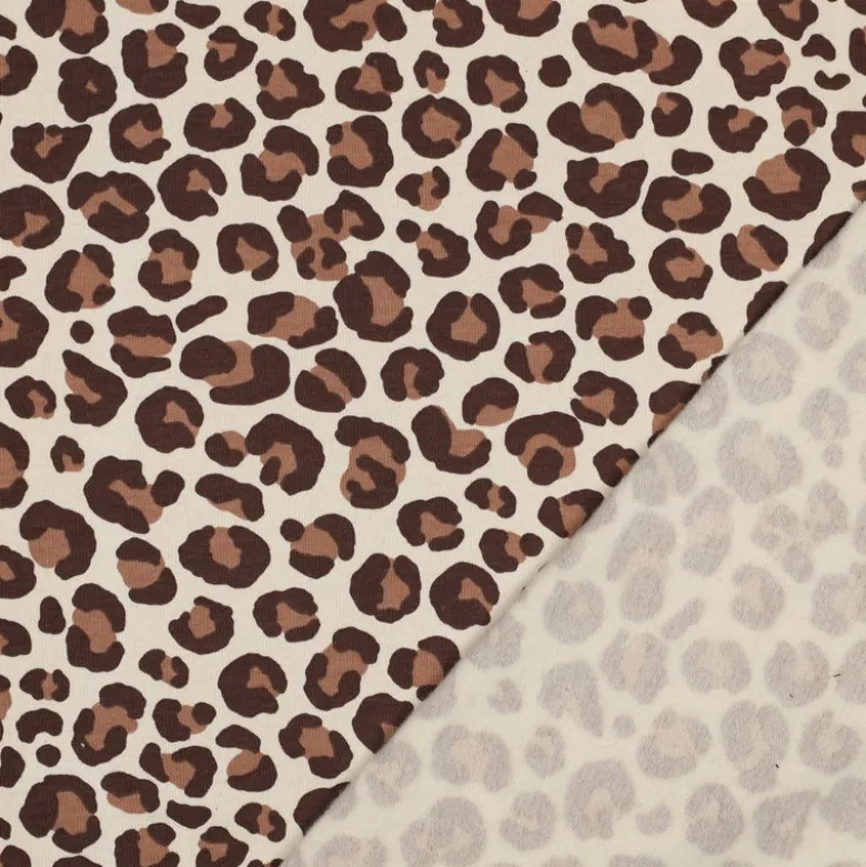 Tissu Sweat gratté motif Léopard caramel fond écru