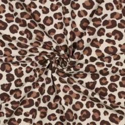 Tissu Sweat gratté motif Léopard caramel fond écru
