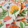 Tissu toile imprimée fleurs multicolores sur fond écru