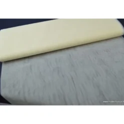 Tissu Tulle raide coloris ivoire 100% polyamide 300cm 27gr/m² .