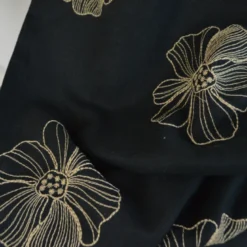 Tissu viscose lin motif fleurs sables fond noir