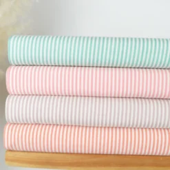 Tissu viscose mélangée à rayures tangerine et blanches