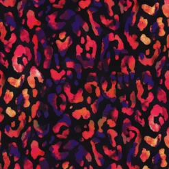 Tissu viscose motif léopard rose orange fond noir