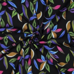 Tissu viscose stretch motif feuillage bleu vert fond noir