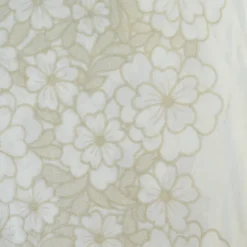 Tissu voile de coton brodé beige motif fleurs fond sable