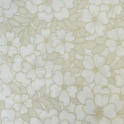 Tissu voile de coton brodé beige motif fleurs fond sable
