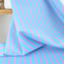 Tissu voile de coton Rudayan à rayures rose fond turquoise