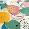 Toile cirée motif fruits fond blanc cassé