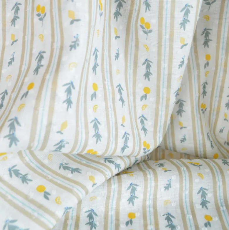 Voile plumetis rayures et citrons fond écru